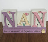 Nan Never runs out of hugs and kisses, floral style table block