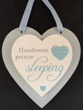 close up of double heart plaque "Handsome prince sleeping"